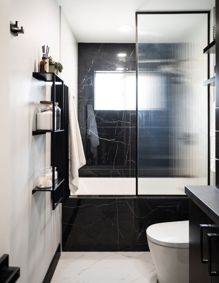bathroom renovation with Village Flooring & Renovations in Santee, CA. Black and white shower tiles and floors