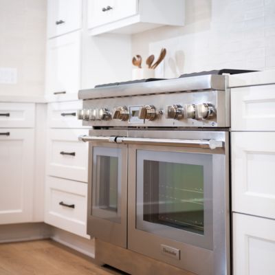 Santee kitchen with stainless steel range and white cabinets