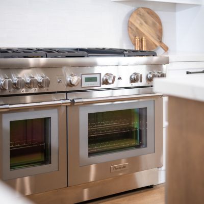 Santee kitchen renovation with stainless steel oven and white tile backsplash
