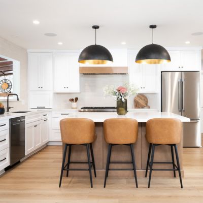 stylish Santee kitchen remodel with island, stools, black lights, and white cabinets