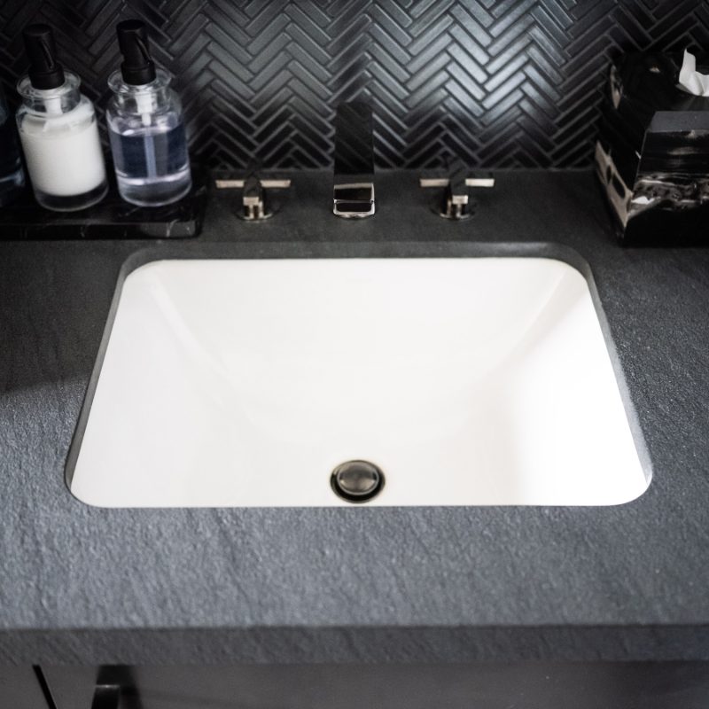 sink remodel with black bath counters