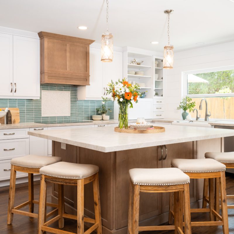 custom kitchen remodel with island, backsplash, and cabinets