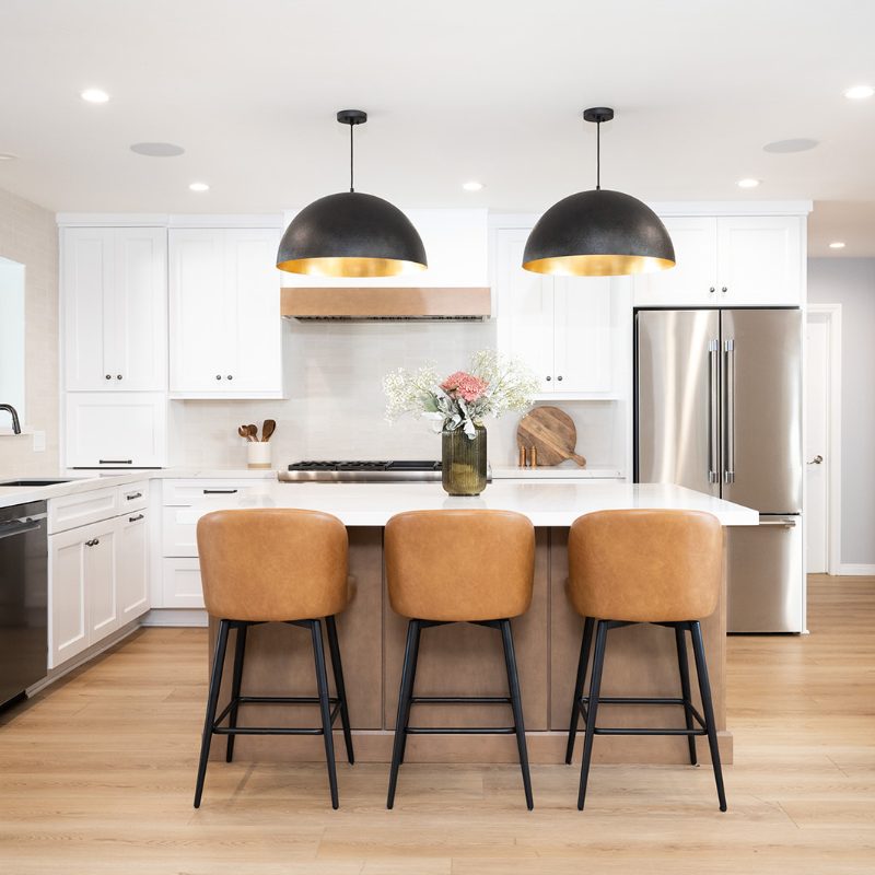 stylish kitchen remodel with cabinets, wood look floors, and kitchen island